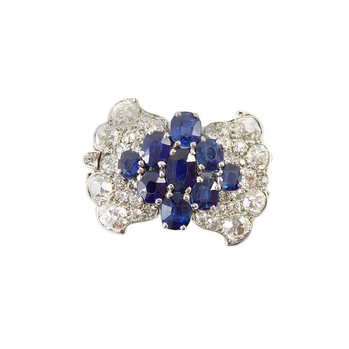 Art Deco sapphire and diamond clasp, with fittings for four rows, of stylised bow design